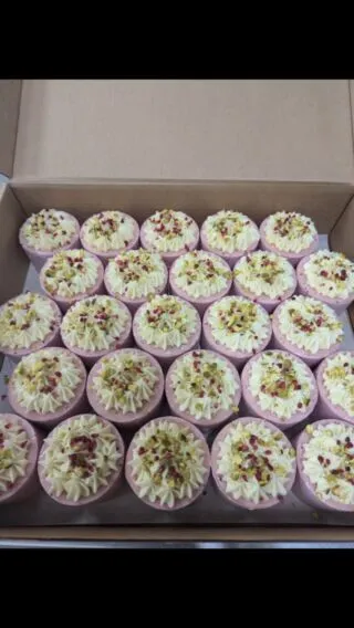 Individual vegan and gluten free raspberry and pistachio cheesecake